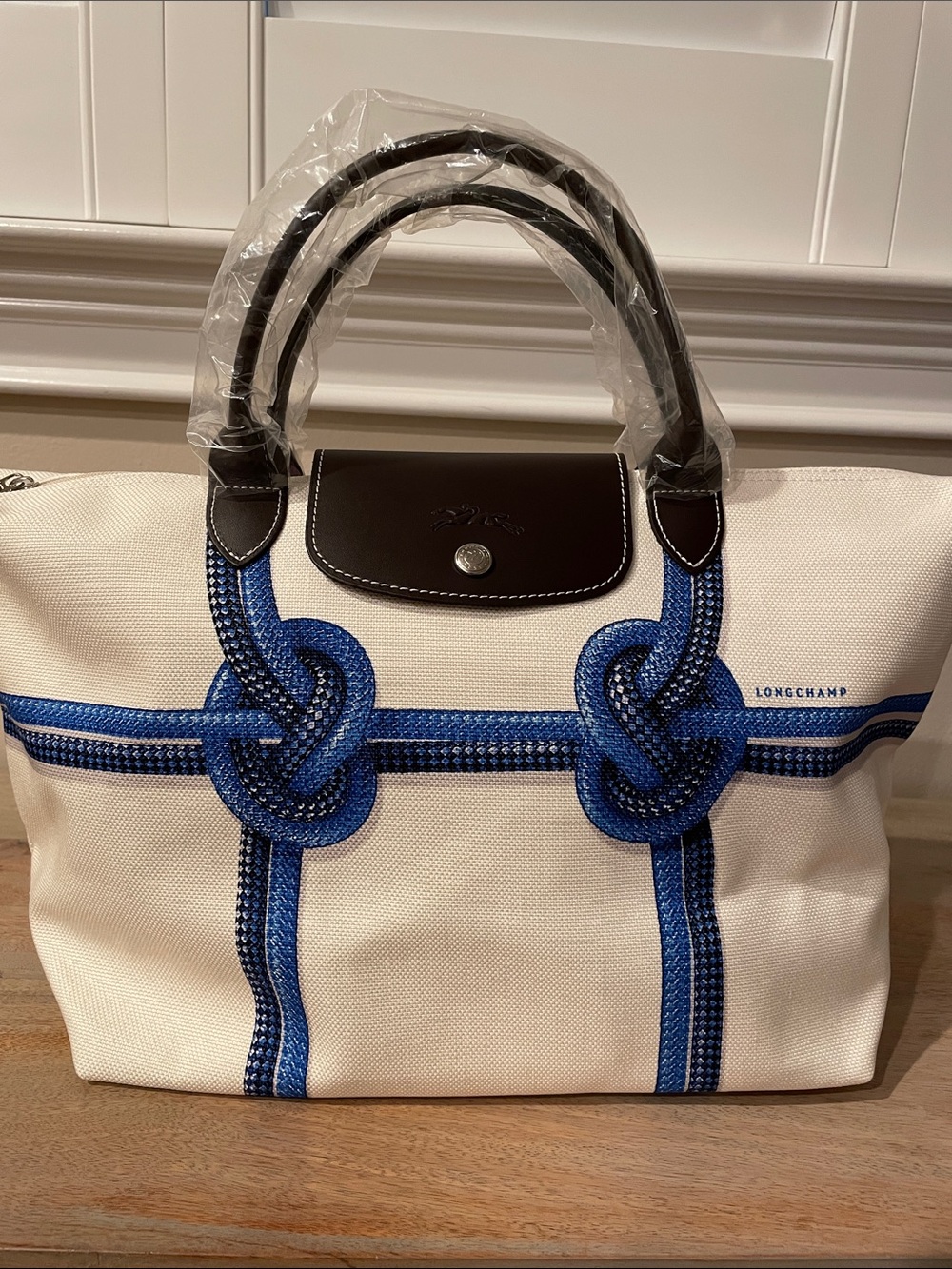 Brand new Longchamp Canvas Tote with Blue Rope Knot Accents and Dark Brown Trim